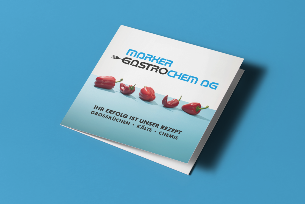 A closed brochure from Marxer Gastrochem AG on a blue background, with a row of peppers on the front cover