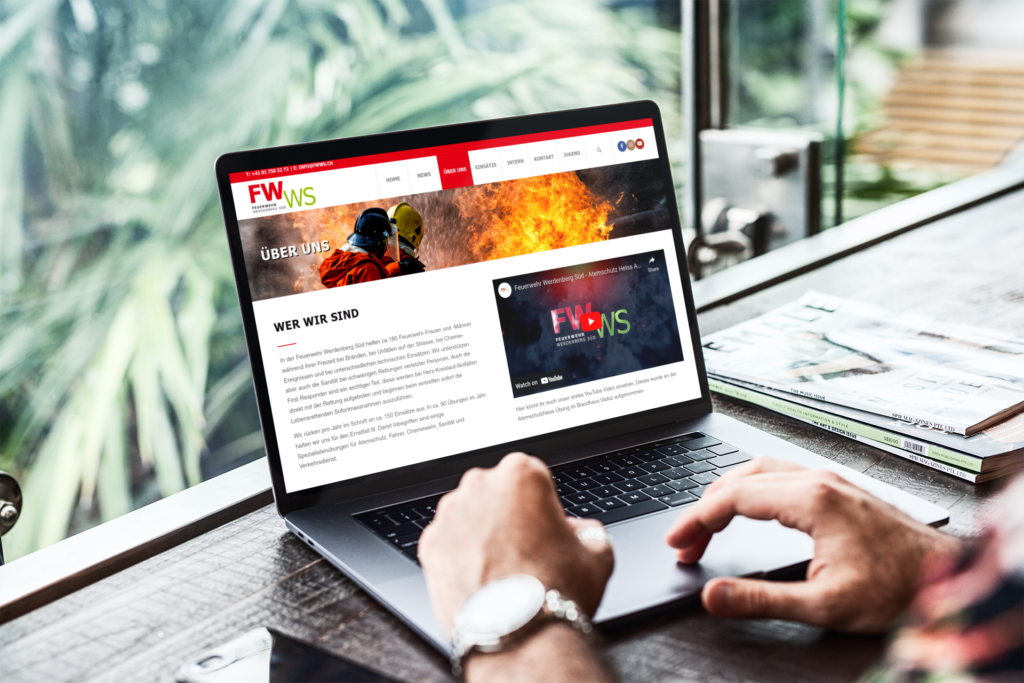 MacBook displaying the ‘About Us’ page of the Feuerwehr Werdenberg Süd, featuring an embedded video